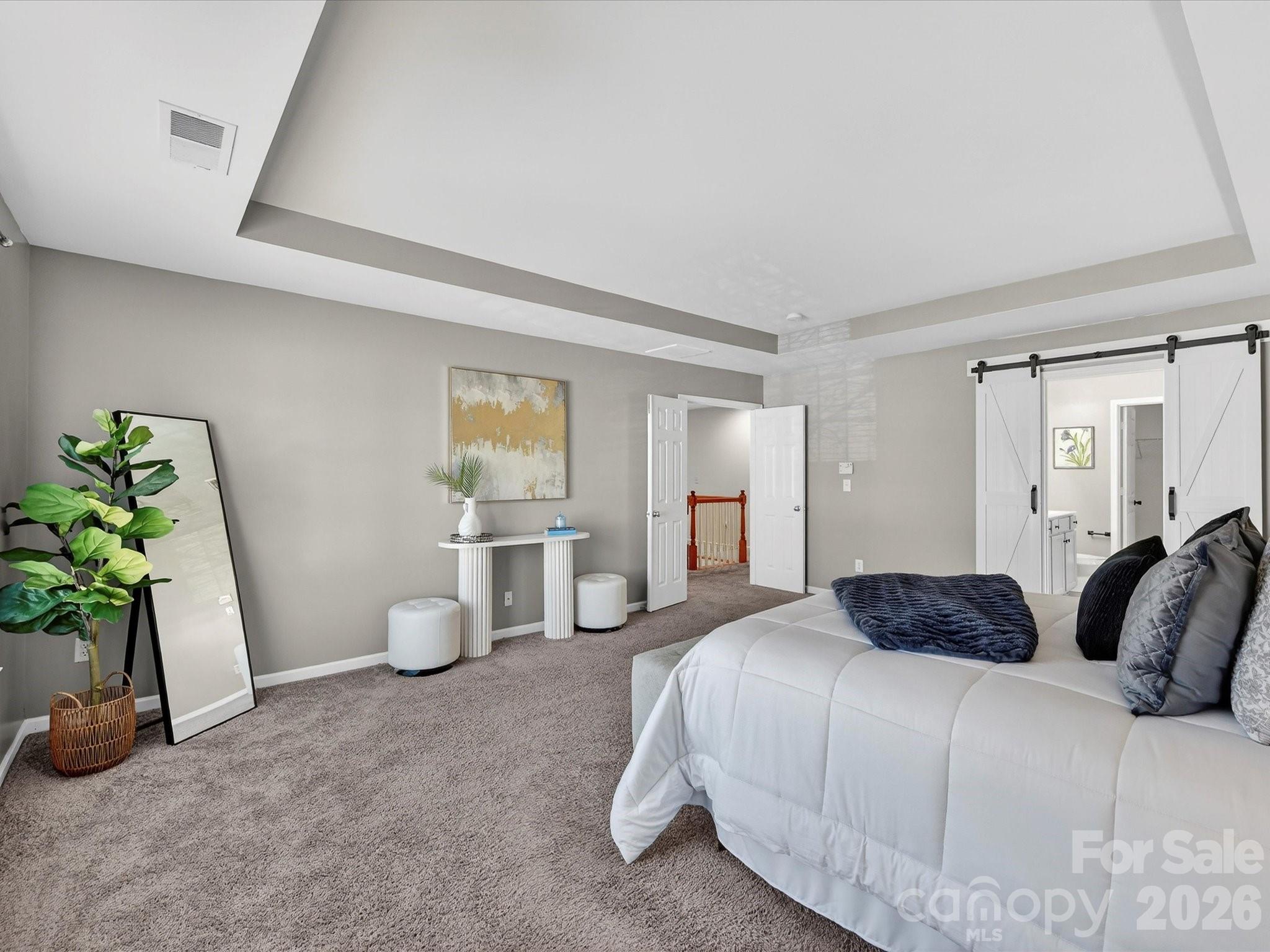 119 Edgington Street Mooresville, NC 28115 - Photo 22 of 43 a bedroom with a bed and a potted plant