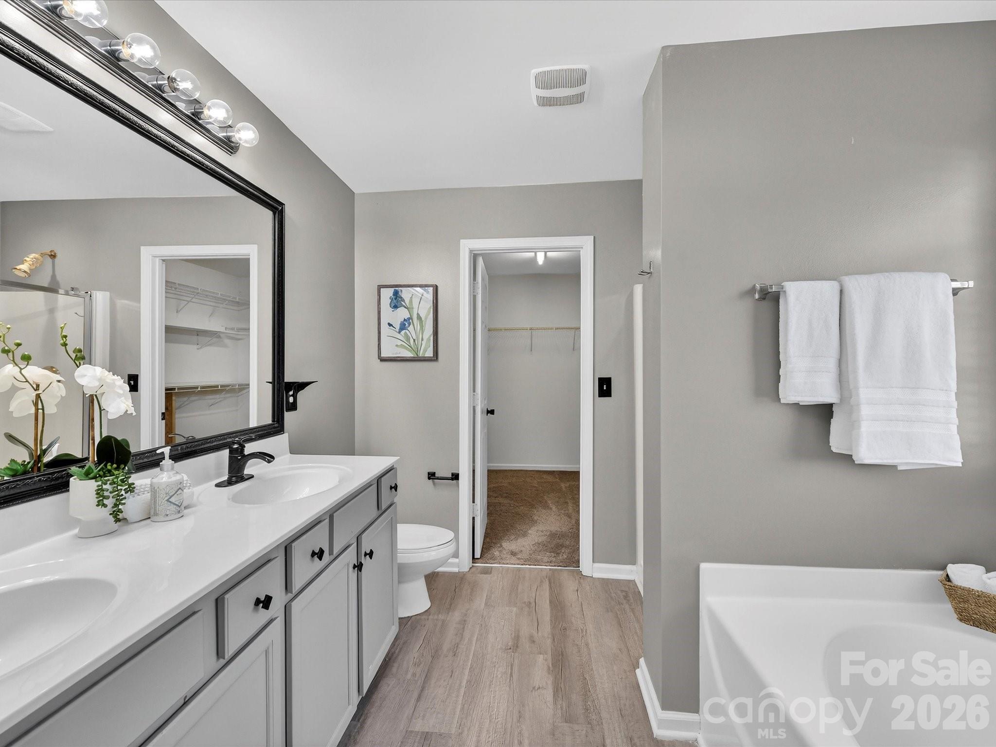 119 Edgington Street Mooresville, NC 28115 - Photo 23 of 43 a spacious bathroom with a double vanity sink a mirror and shower