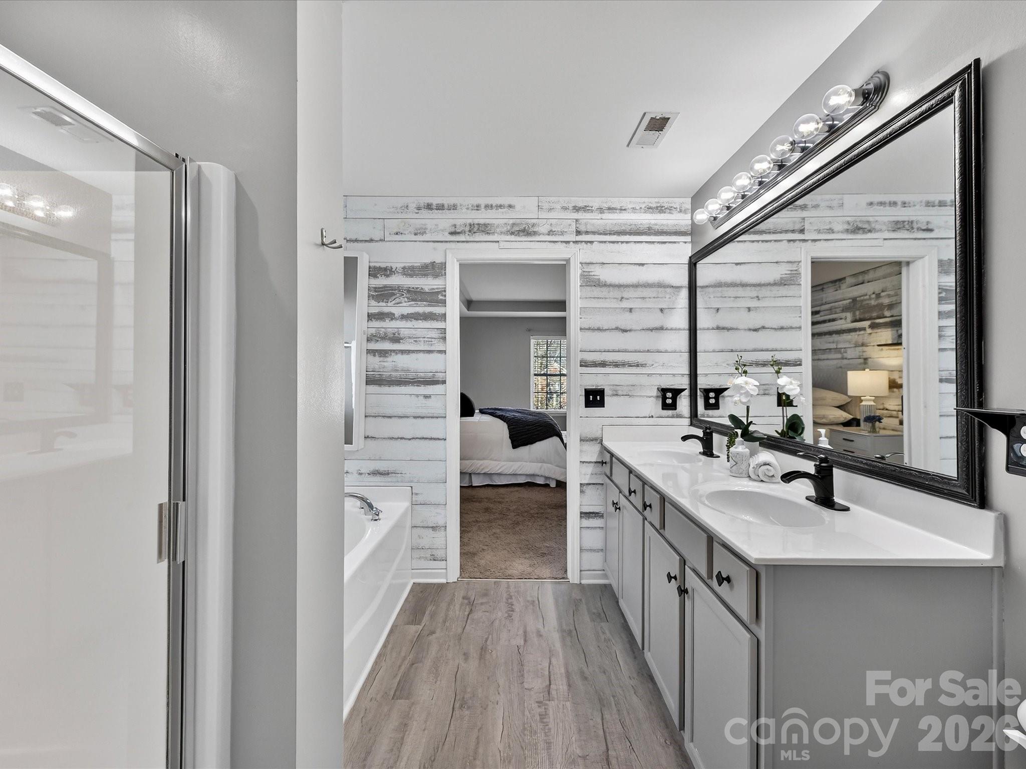 119 Edgington Street Mooresville, NC 28115 - Photo 24 of 43 a kitchen with a sink stove and cabinets