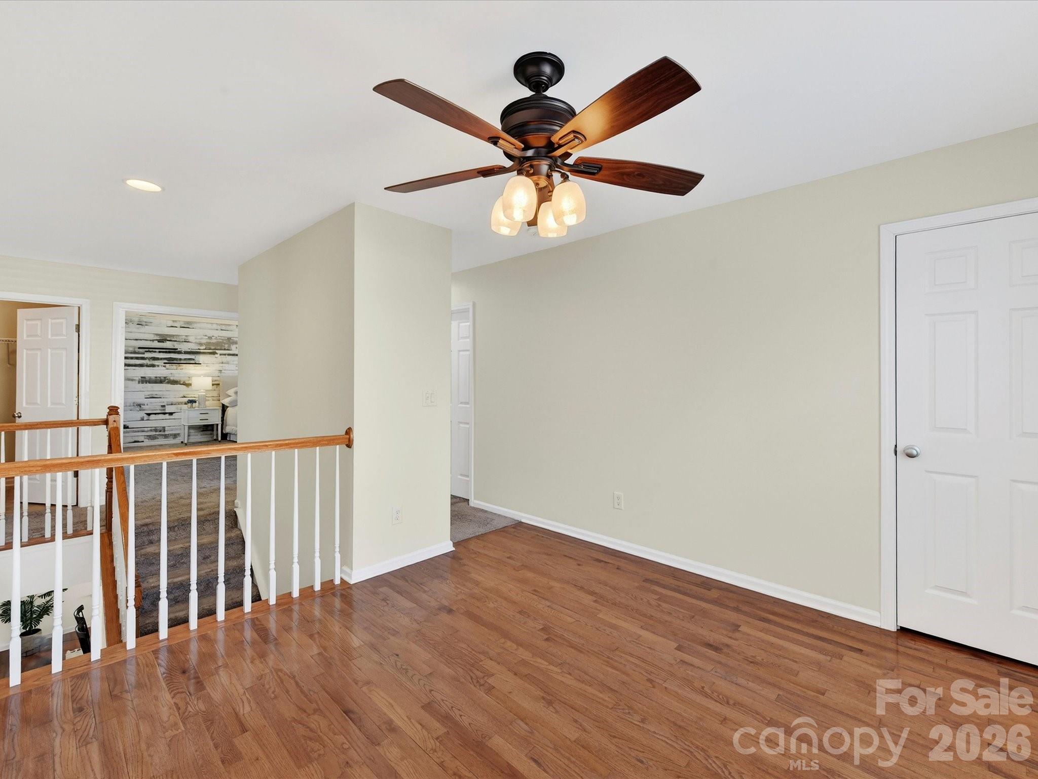 119 Edgington Street Mooresville, NC 28115 - Photo 28 of 43 wooden floor in an empty room with a window