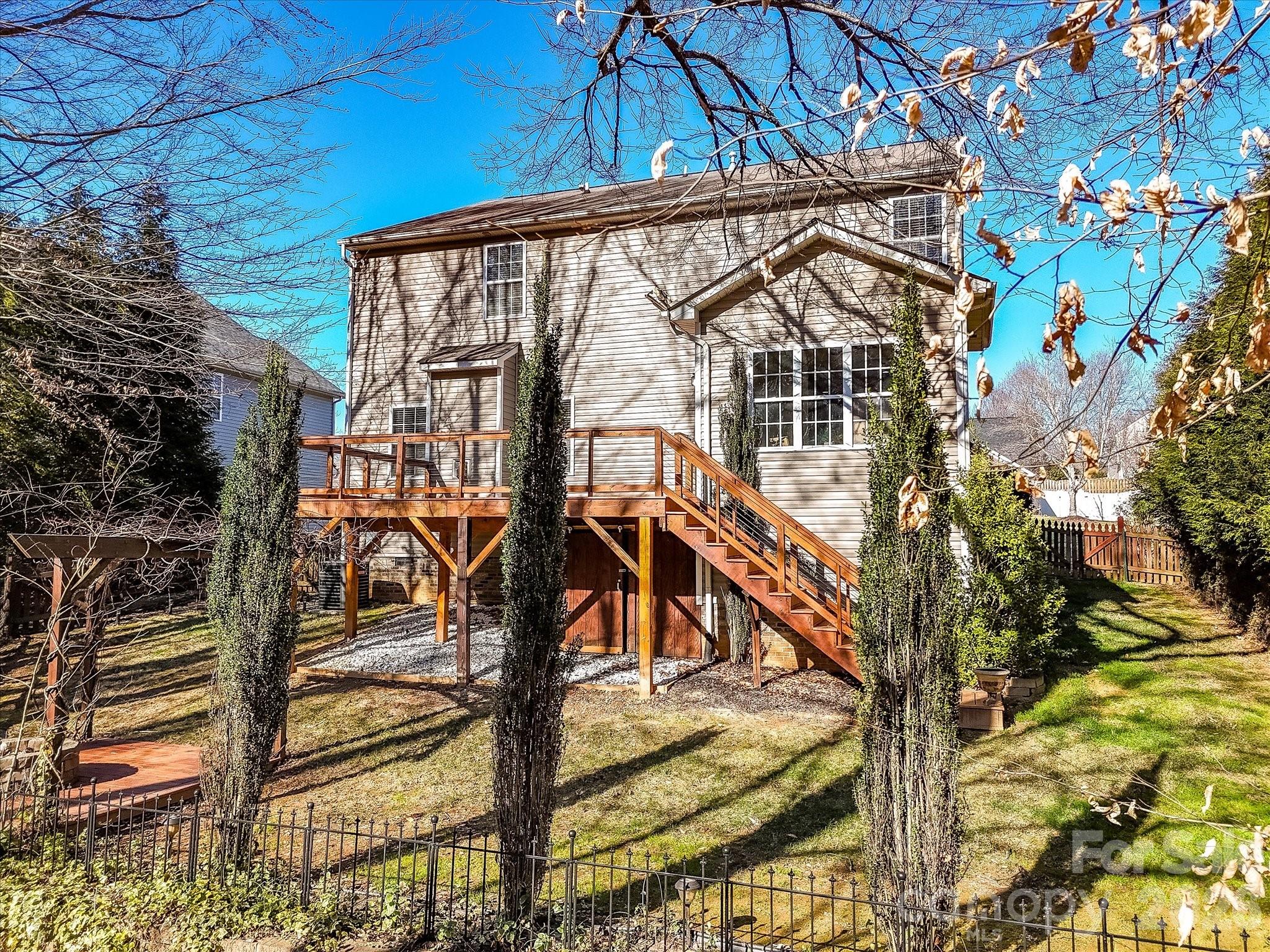 119 Edgington Street Mooresville, NC 28115 - Photo 35 of 43 a view of a house with backyard and sitting area