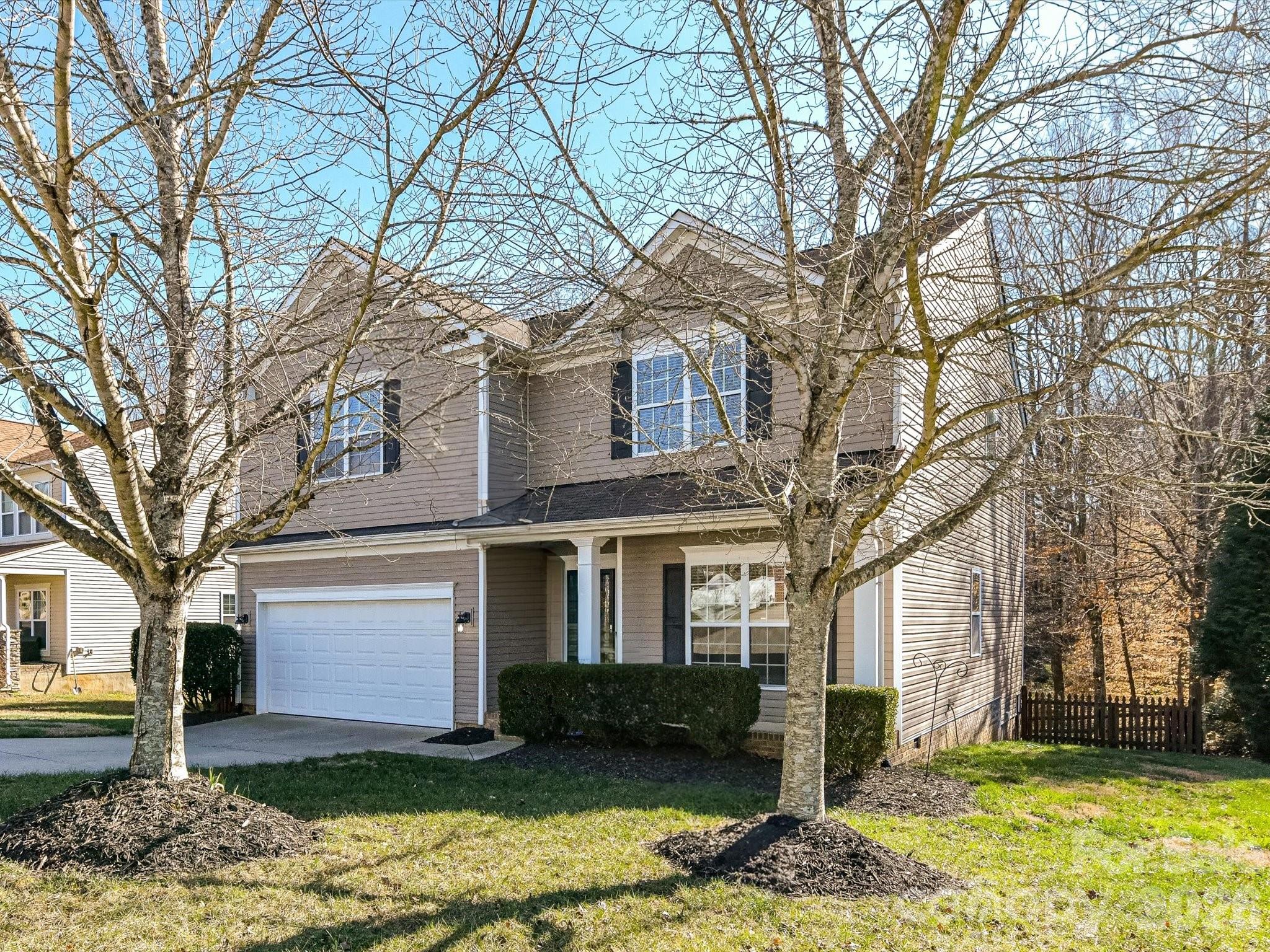 119 Edgington Street Mooresville, NC 28115 - Photo 4 of 43 a front view of a house with a yard