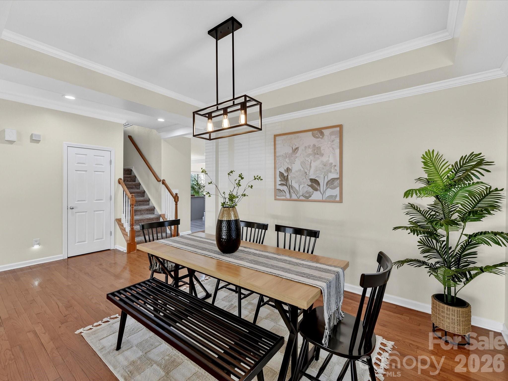 119 Edgington Street Mooresville, NC 28115 - Photo 9 of 43 a view of a livingroom and dining room with furniture wooden floor and a chandelier