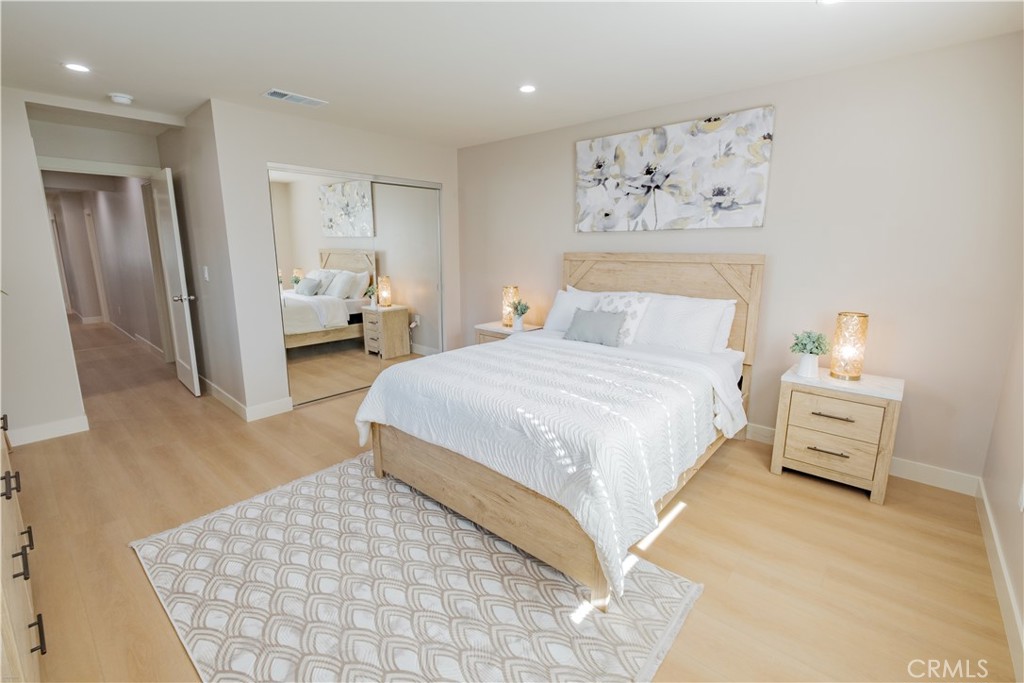 223 South Aprilia Avenue Compton, CA 90220 - Photo 25 of 46 a bedroom with a bed and a couch