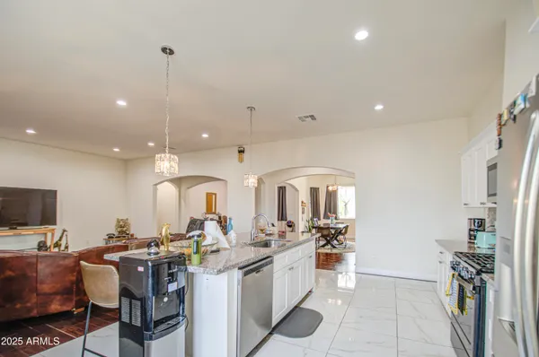 a bedroom with furniture and a window