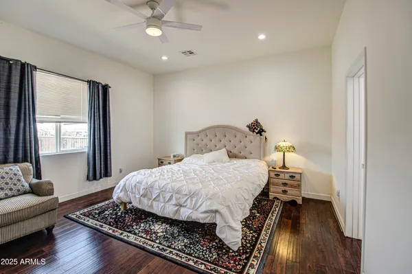 a bedroom with a bed and a table in it