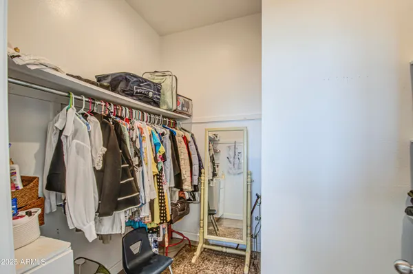 a room with a wall painting and a painting on the wall