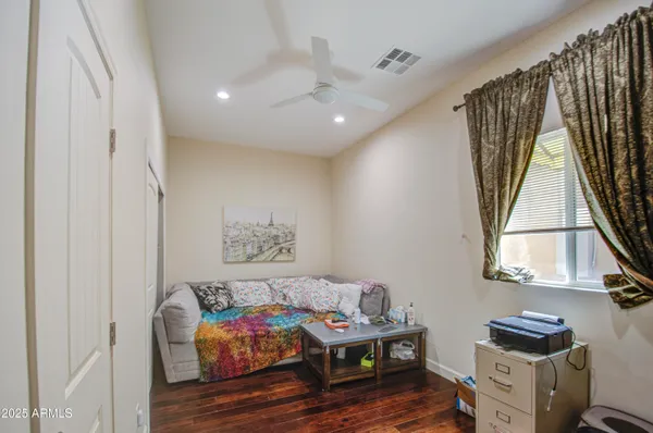 a white bath tub sitting next to a white toilet and sink