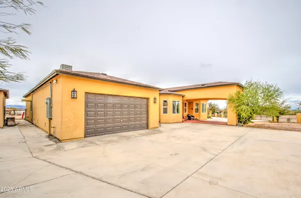 a living room with furniture flat screen tv and wooden floor