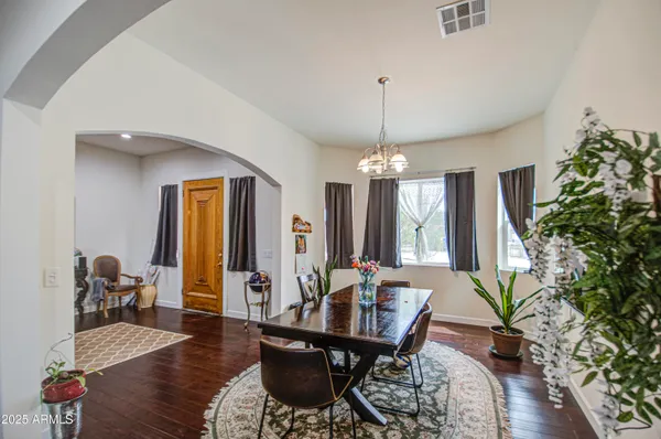 a bedroom with furniture and a window