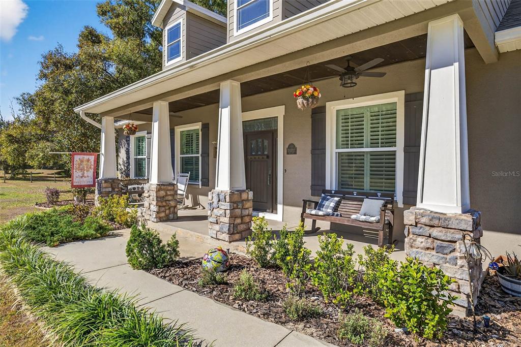 18051 Hancock Bluff Road Dade City, FL 33523 - Photo 11 of 98 front view of a house with a patio