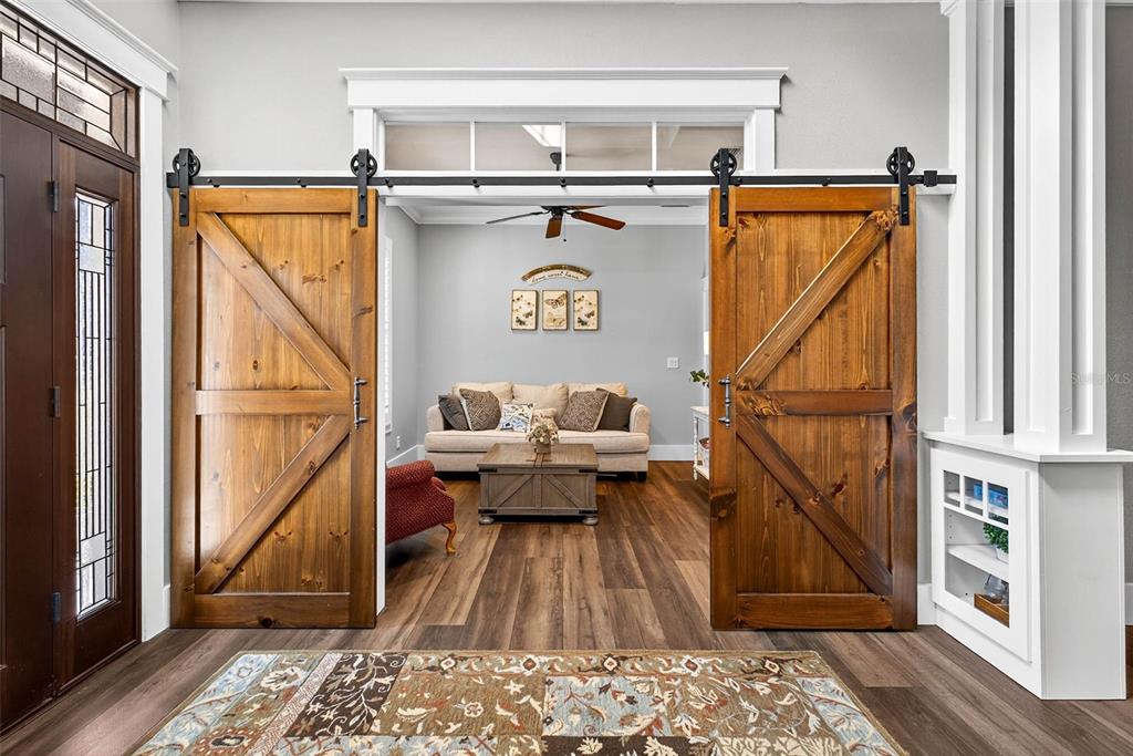 18051 Hancock Bluff Road Dade City, FL 33523 - Photo 15 of 98 a view of living room with furniture and a rug