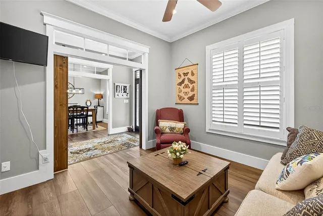 a living room with lots of furniture and kitchen view
