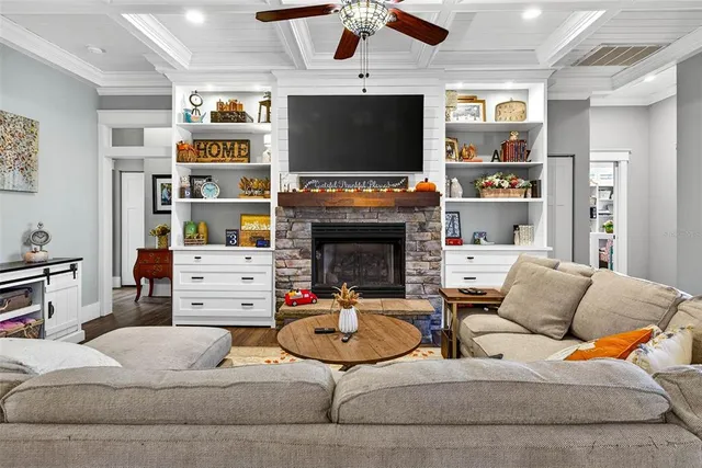 a kitchen with stainless steel appliances granite countertop a refrigerator a stove and a sink