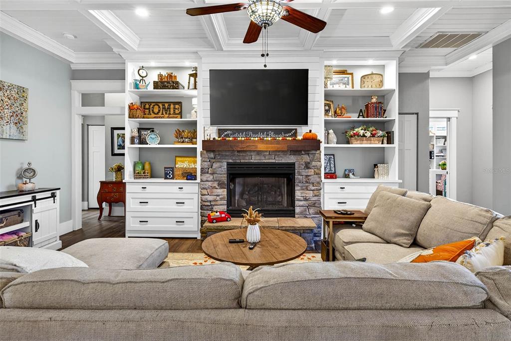 18051 Hancock Bluff Road Dade City, FL 33523 - Photo 21 of 98 a living room with furniture and a flat screen tv