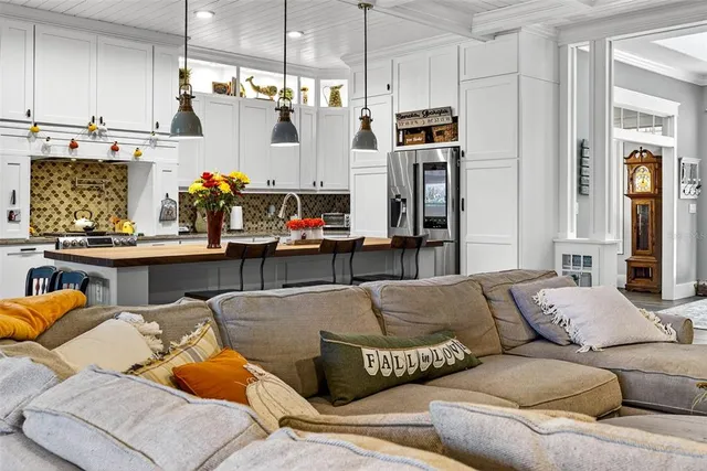 a dining room with furniture and window