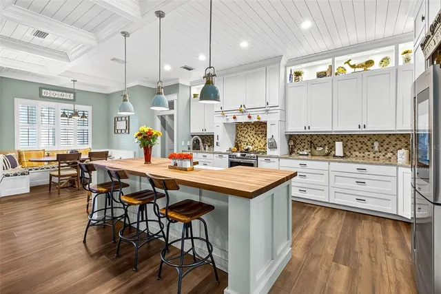 a bathroom with a granite countertop sink toilet a mirror and shower