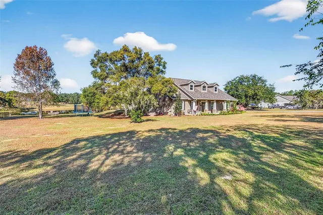 a view of living room with furniture and window