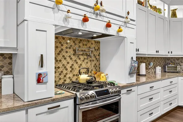 a bathroom with a sink a mirror and a shower