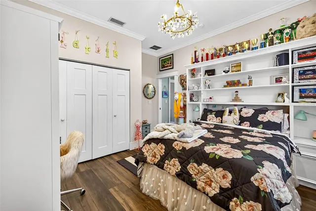 a view of swimming pool with a table and chairs under an umbrella