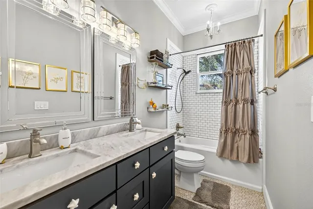 a living room with lots of furniture and a chandelier