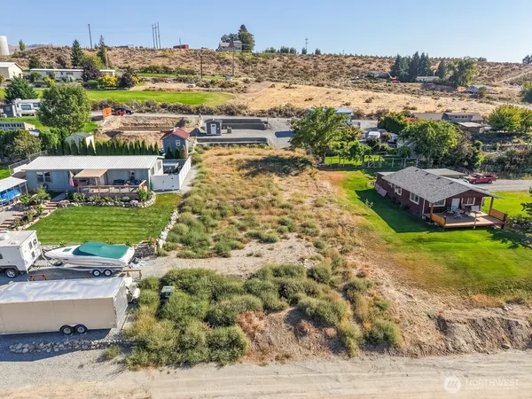 an aerial view of residential houses and outdoor space