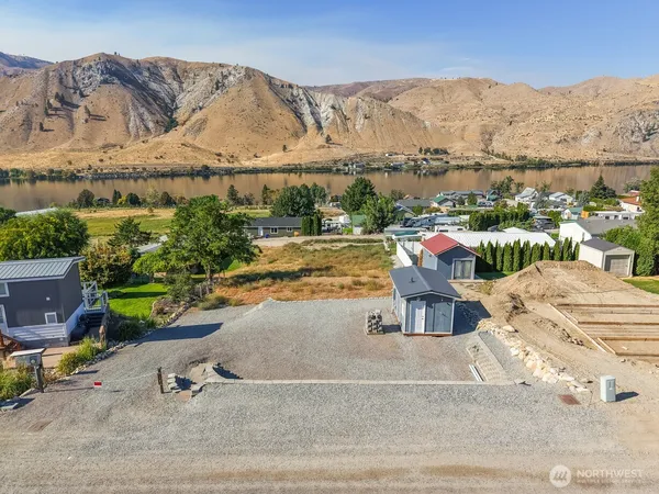 an aerial view of a house with a yard