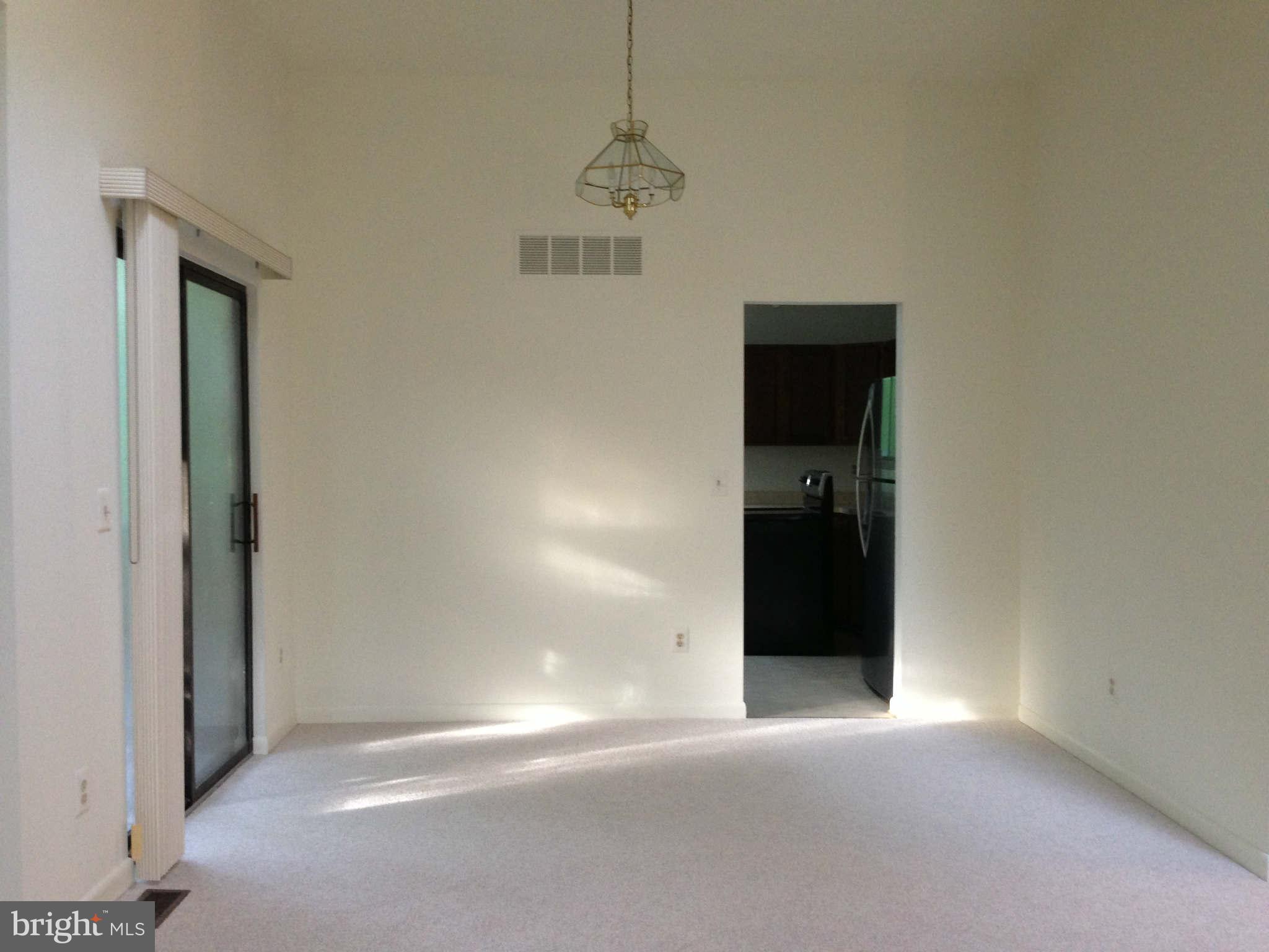 58 Jones Station Road Arnold, MD 21012 - Photo 9 of 28 Dining Room w/sliding doors and cathedral ceilings