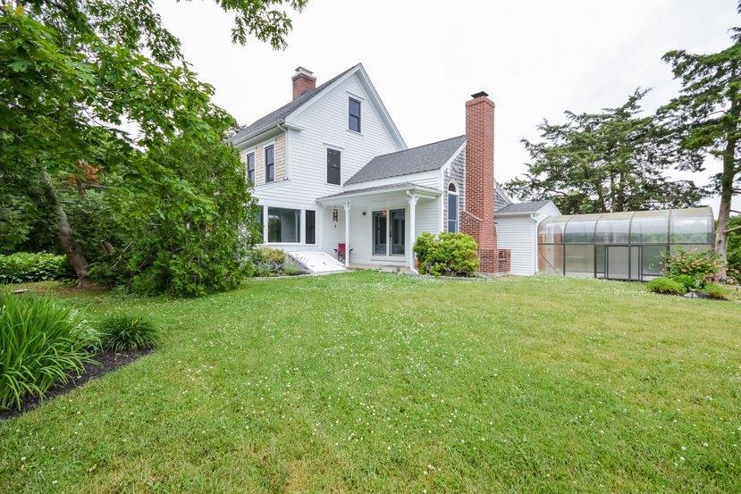 32 Fairhaven Road Mattapoisett, MA 02739 - Photo 2 of 11 a front view of a house with garden