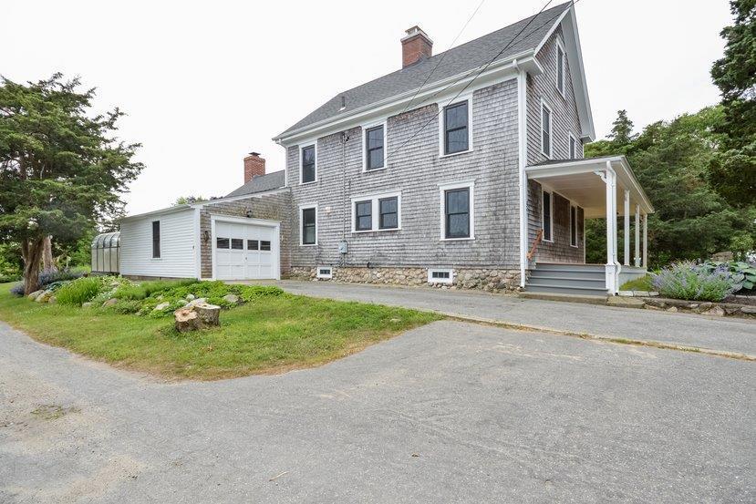 32 Fairhaven Road Mattapoisett, MA 02739 - Photo 3 of 11 a front view of a house with garden