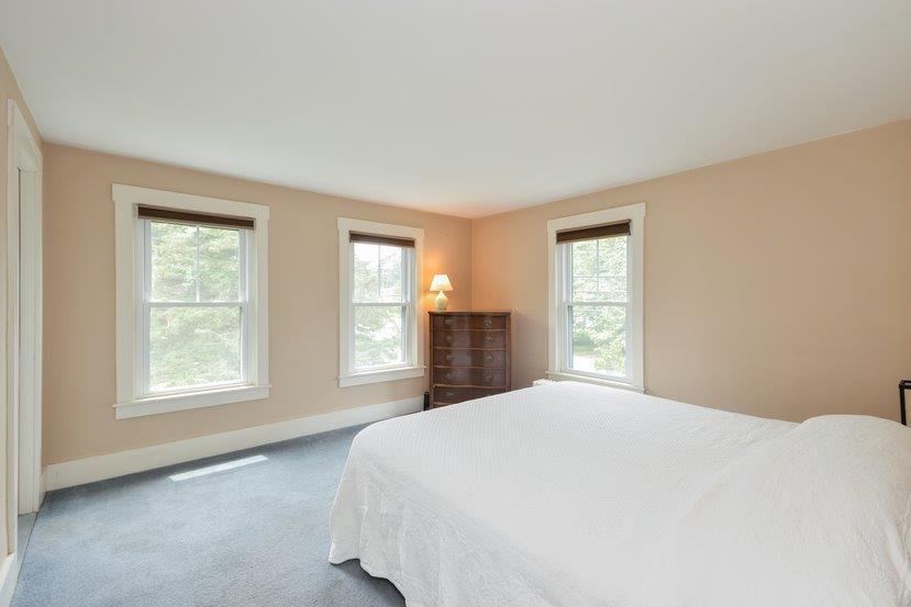 32 Fairhaven Road Mattapoisett, MA 02739 - Photo 10 of 11 a bedroom with a large bed and a window
