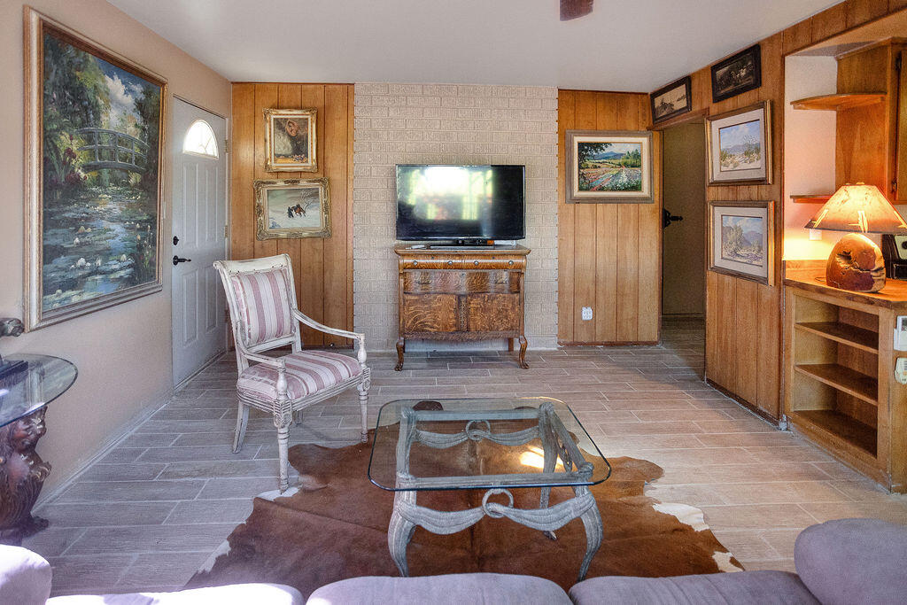 5134 Malin Way Yucca Valley, CA 92284 - Photo 13 of 27 a living room with furniture and a flat screen tv