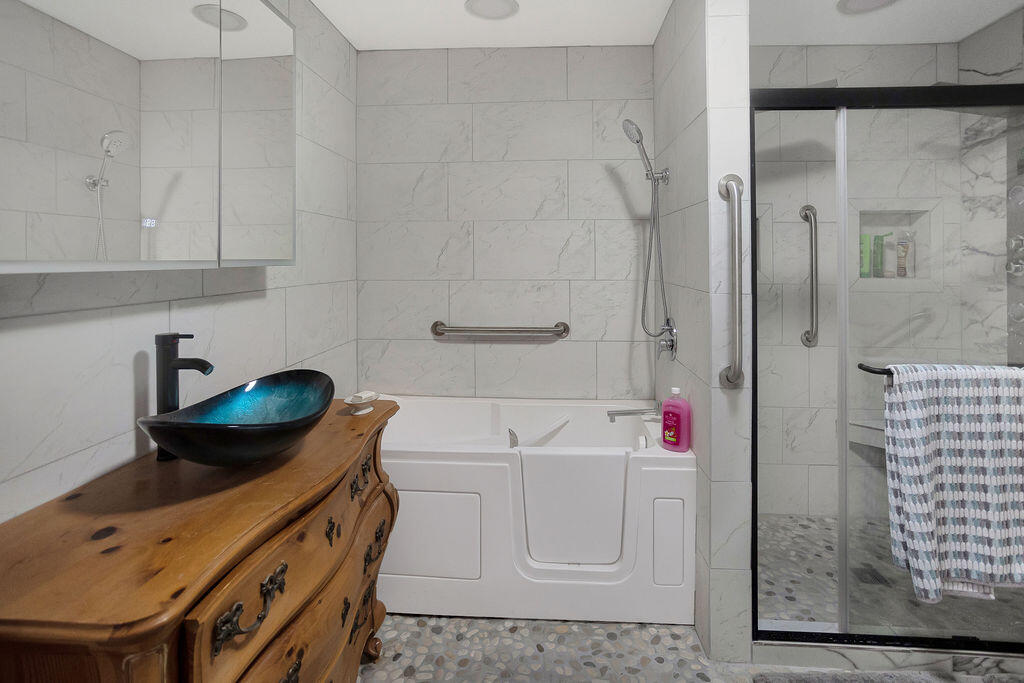 5134 Malin Way Yucca Valley, CA 92284 - Photo 16 of 27 a bathroom with a sink a toilet and shower