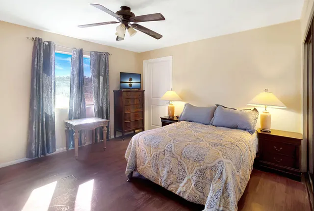 a bedroom with a bed and a table