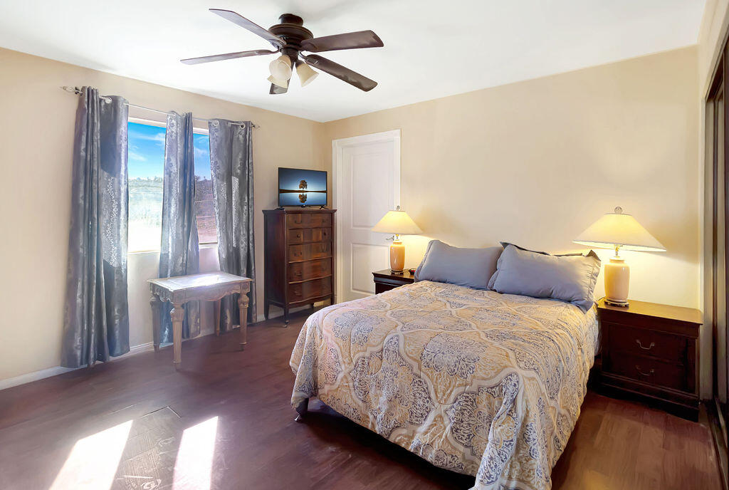 5134 Malin Way Yucca Valley, CA 92284 - Photo 18 of 27 a bedroom with a bed and a table