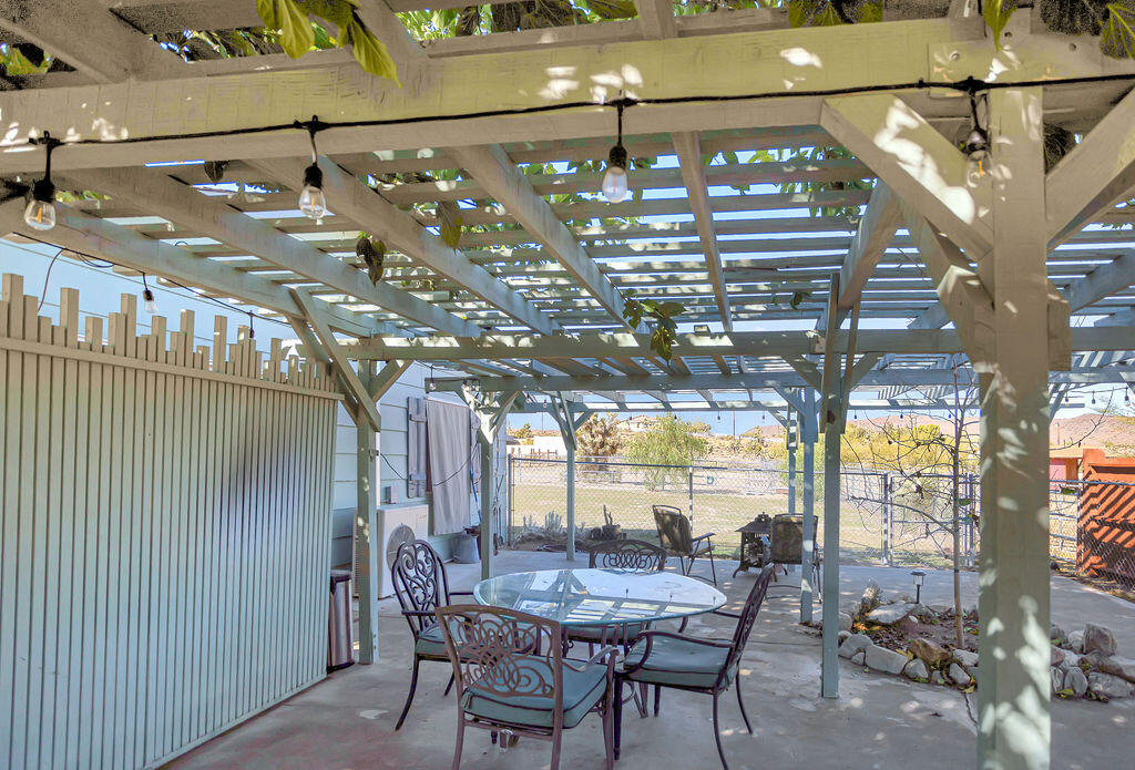 5134 Malin Way Yucca Valley, CA 92284 - Photo 22 of 27 a view of a chairs and table in a patio