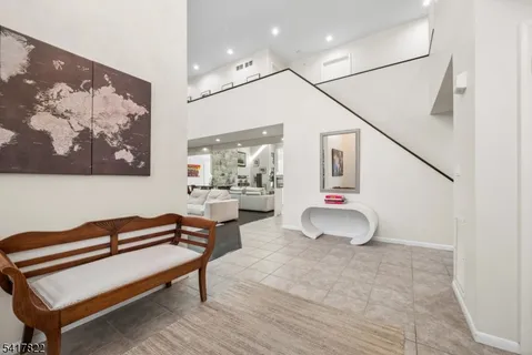 a bedroom with furniture and wooden floor