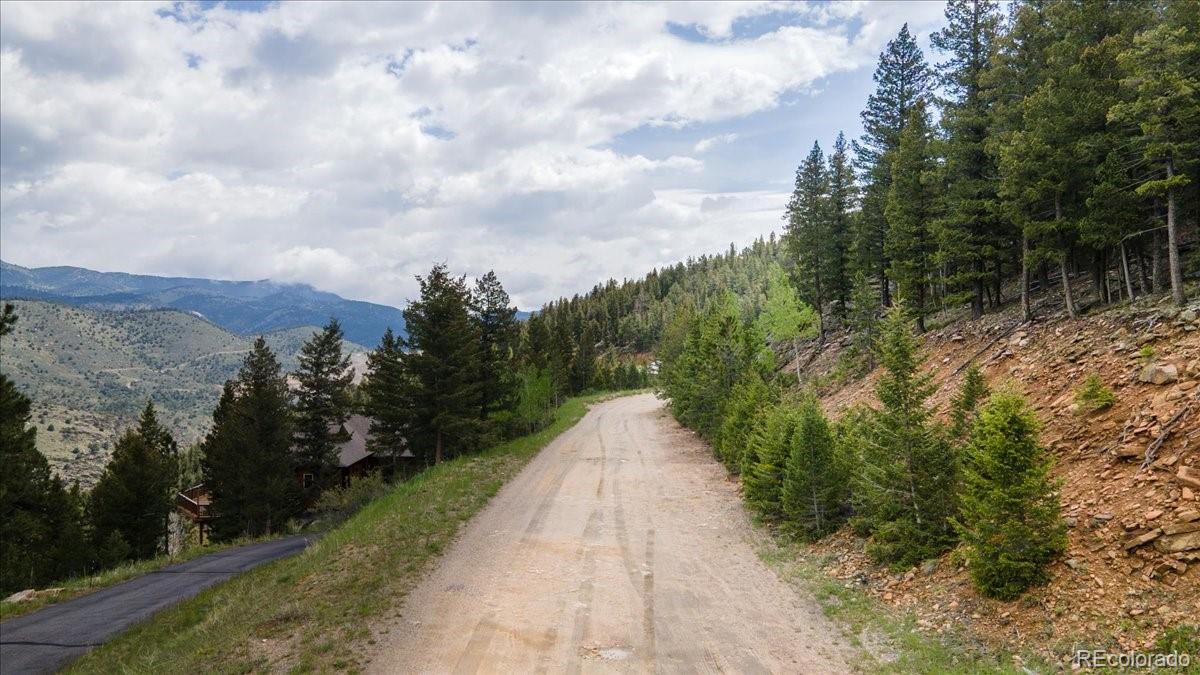 Clear Creek Road Evergreen, CO 80439 - Photo 1 of 26 a view of a pathway with a park