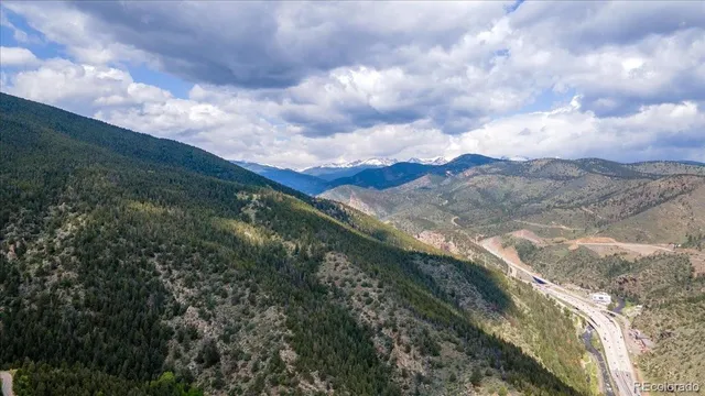 a view of mountains and valleys