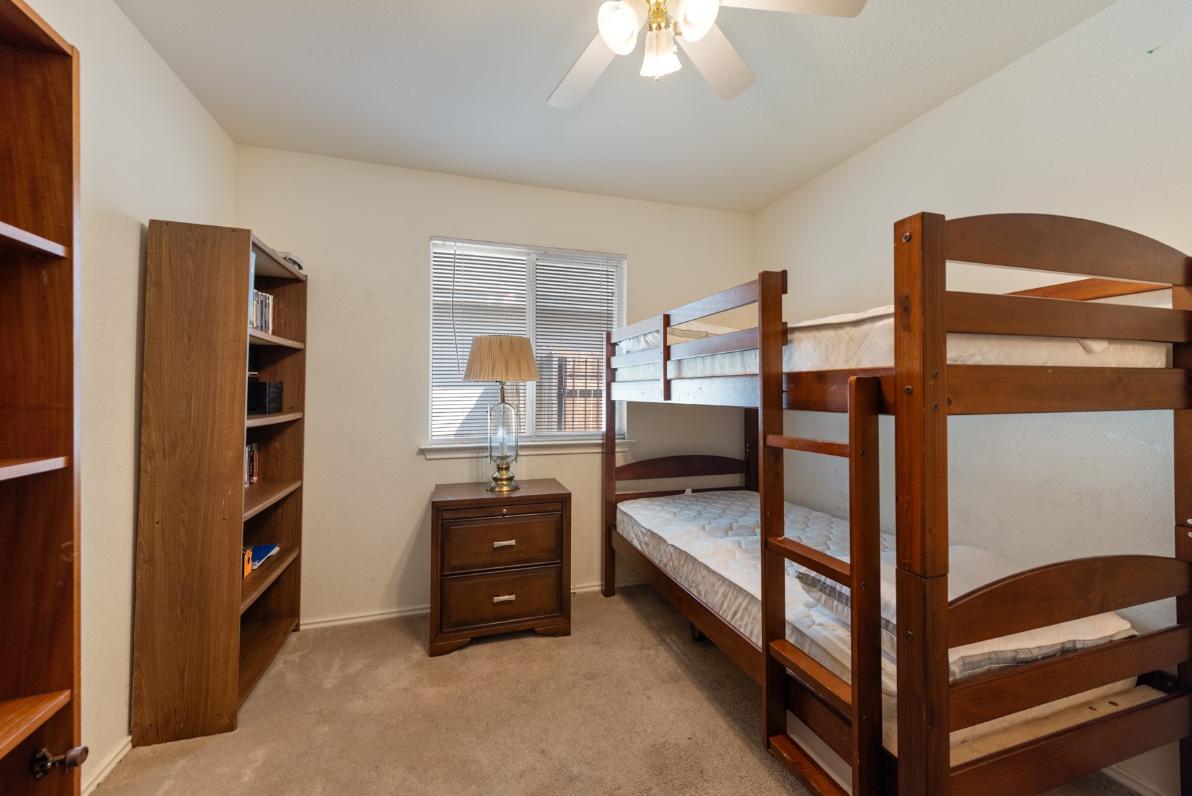 5501 English Avenue Austin, TX 78724 - Photo 10 of 19 a view of bedroom with furniture and window