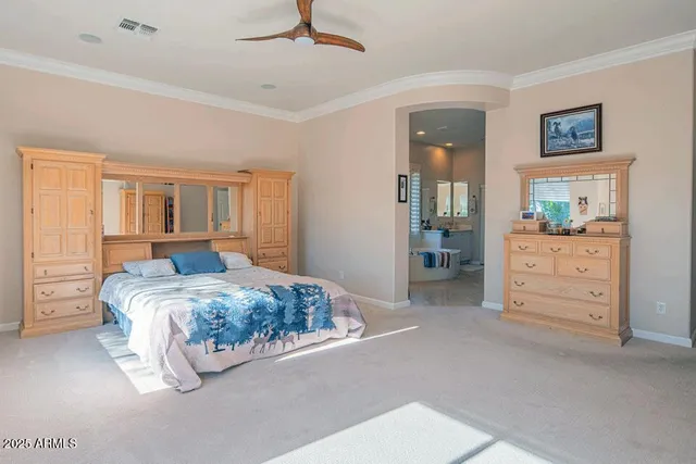 a bedroom with a bed and a cabinets