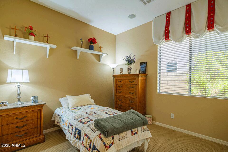 2347 West River Rock Court Phoenix, AZ 85086 - Photo 14 of 25 a bedroom with a bed and a dresser
