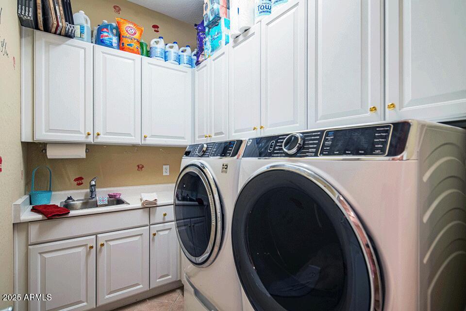 2347 West River Rock Court Phoenix, AZ 85086 - Photo 19 of 25 a utility room with sink dryer and washer
