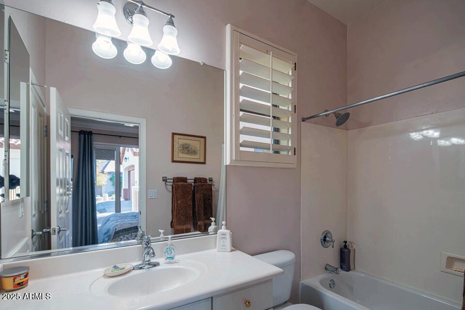 2347 West River Rock Court Phoenix, AZ 85086 - Photo 25 of 25 a bathroom with a sink a toilet and shower