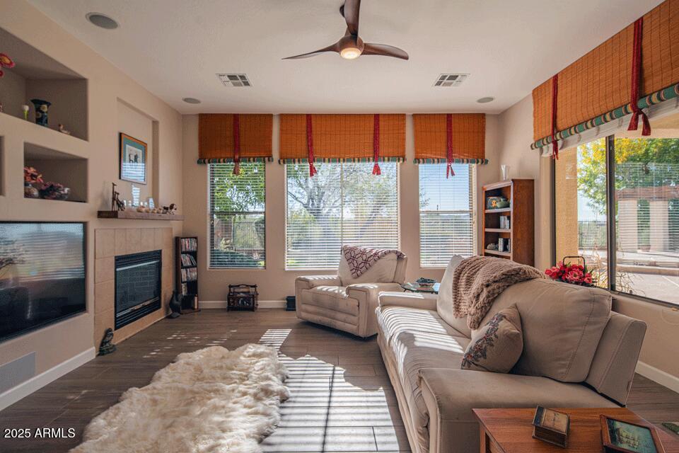 2347 West River Rock Court Phoenix, AZ 85086 - Photo 6 of 25 a living room with furniture and a fireplace