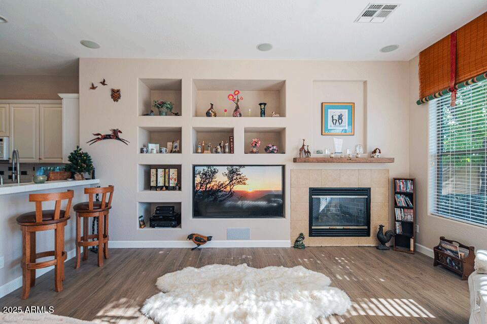 2347 West River Rock Court Phoenix, AZ 85086 - Photo 7 of 25 a living room with furniture and a fireplace