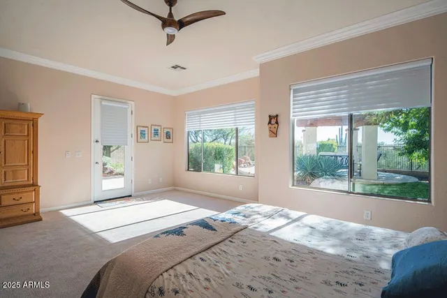 a bedroom with a large bed and a window