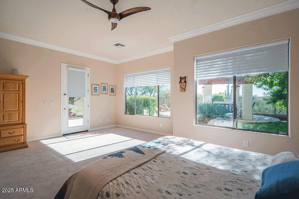 2347 West River Rock Court Phoenix, AZ 85086 - Photo 10 of 25 a bedroom with a large bed and a window