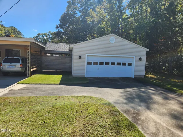 a view of swimming pool with a yard