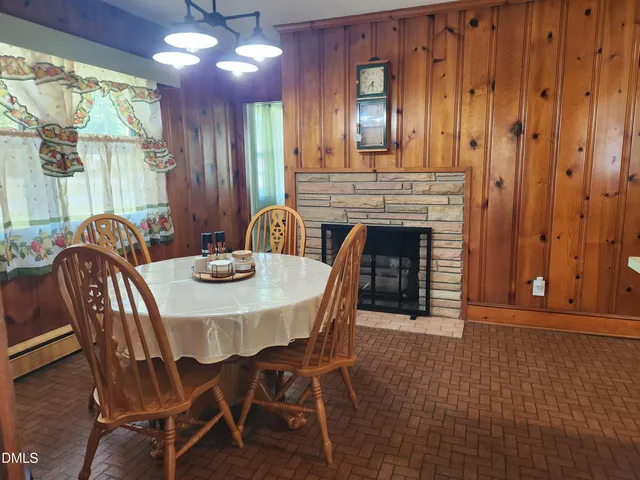 a dining room with furniture and window